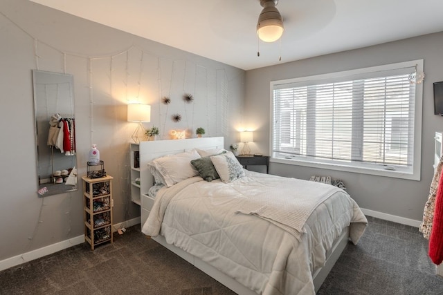 carpeted bedroom with baseboards and a ceiling fan