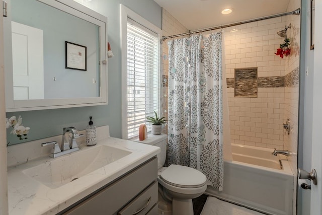 bathroom with toilet, shower / bath combo, and vanity