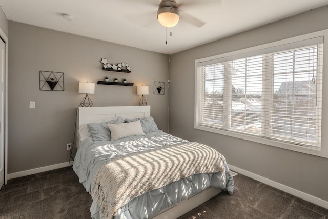 carpeted bedroom featuring baseboards