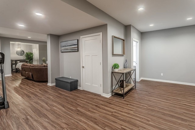 interior space with recessed lighting, baseboards, and wood finished floors