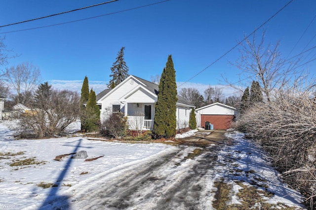 bungalow-style home with an outbuilding