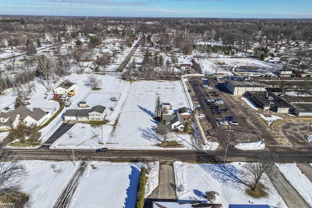 snowy aerial view featuring a residential view