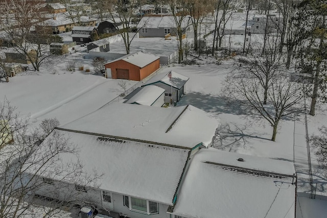 snowy aerial view with a residential view