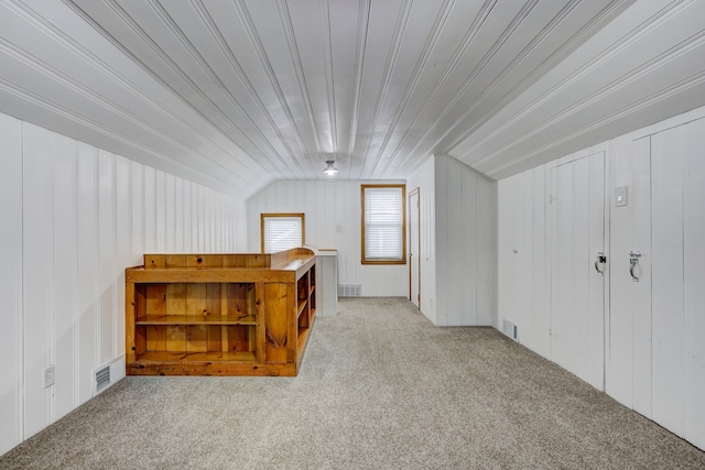 additional living space with carpet flooring and visible vents