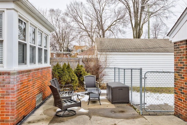 view of patio with a gate and fence