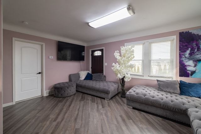 living room with baseboards and wood finished floors