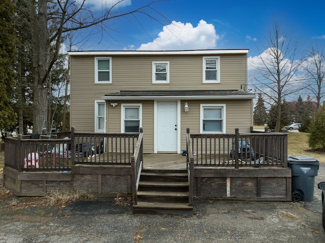 view of front facade with a wooden deck