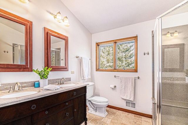 bathroom featuring visible vents, a sink, a shower stall, and double vanity