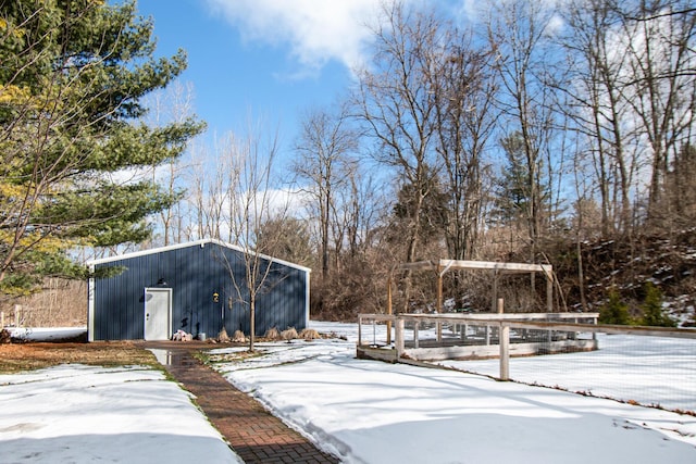 yard covered in snow with an outdoor structure