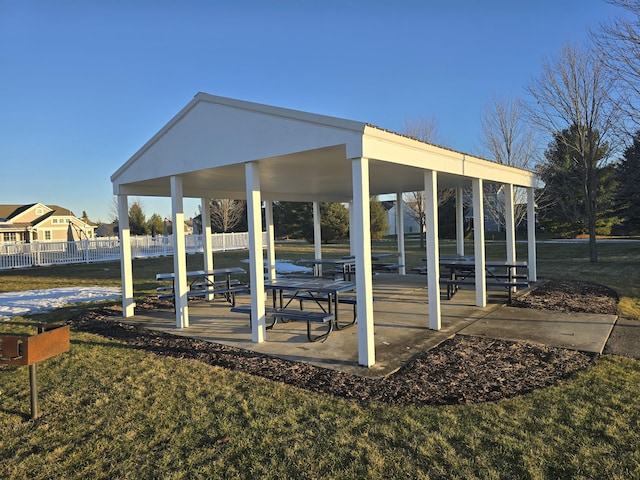 surrounding community featuring fence, a gazebo, and a lawn