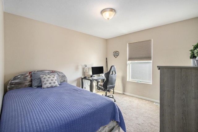 bedroom featuring carpet floors and baseboards