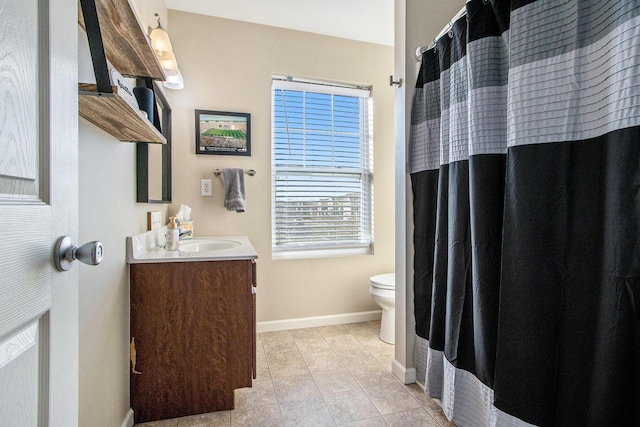 full bath featuring baseboards, toilet, a shower with curtain, tile patterned floors, and vanity