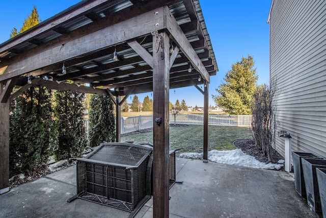 view of patio / terrace featuring fence