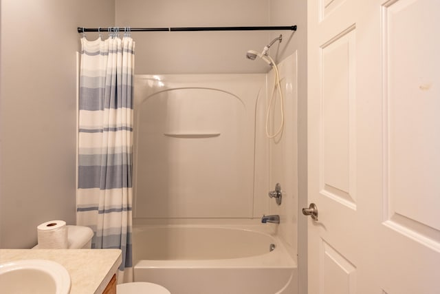 bathroom featuring toilet, shower / bath combination with curtain, and vanity