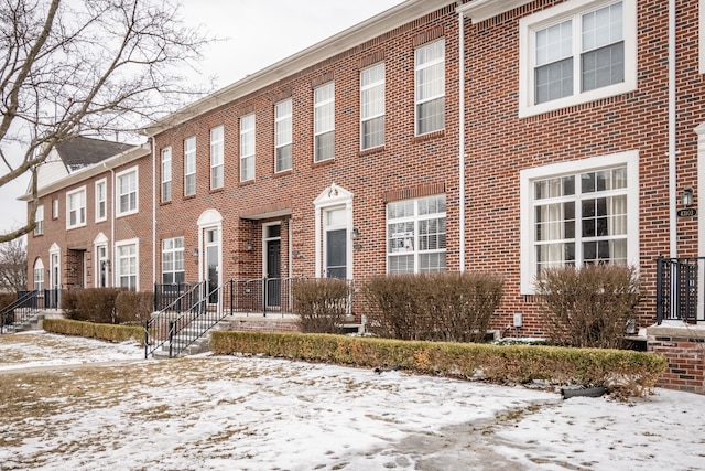 view of front of house with brick siding