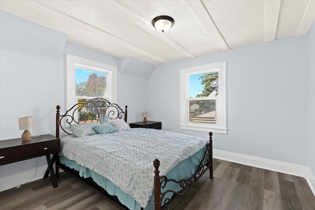 bedroom with dark wood-type flooring, multiple windows, and baseboards