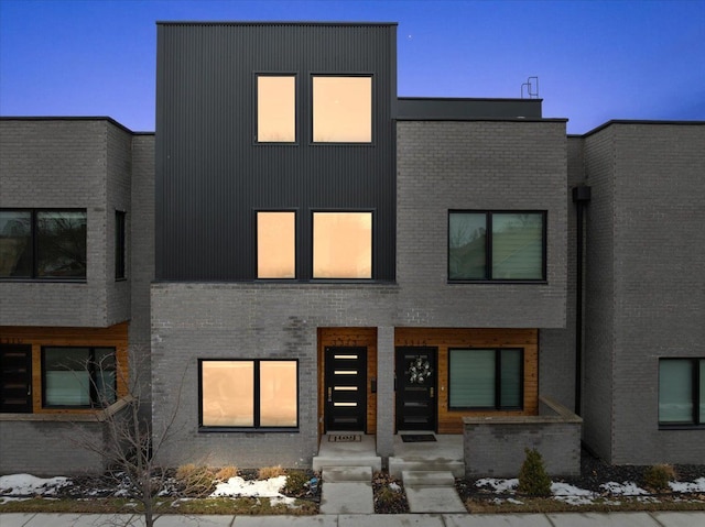 contemporary house with brick siding