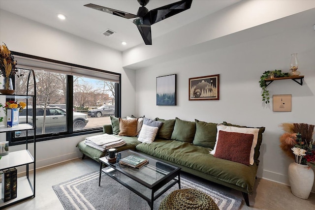 living area with a ceiling fan, recessed lighting, visible vents, and baseboards