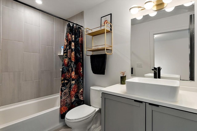 full bathroom featuring shower / bath combination with curtain, vanity, and toilet