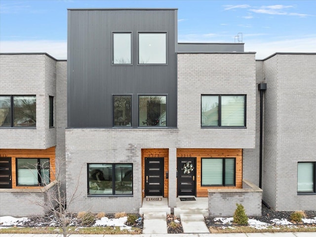 contemporary house with brick siding