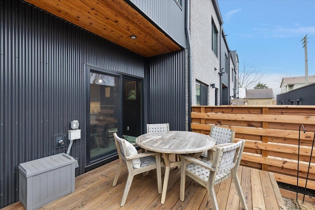 wooden deck featuring outdoor dining space