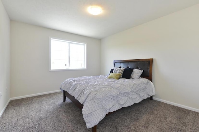 carpeted bedroom with baseboards