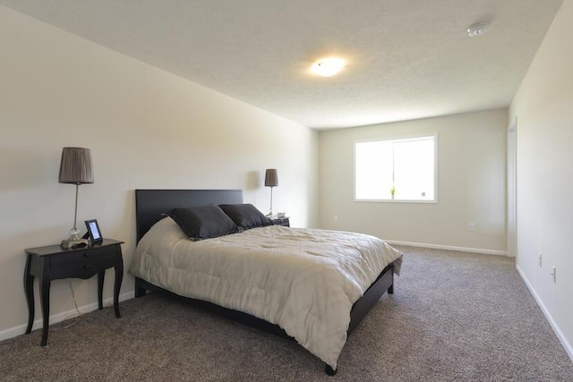 bedroom featuring carpet floors and baseboards