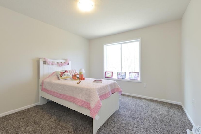 carpeted bedroom featuring baseboards