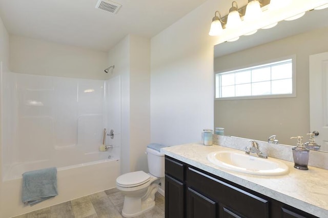 bathroom featuring toilet, shower / bathtub combination, vanity, and visible vents