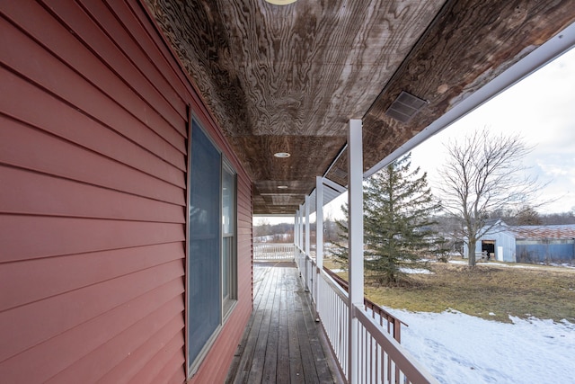 view of snow covered deck