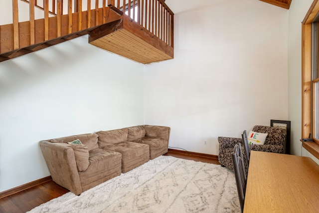 living room featuring wood finished floors and baseboards