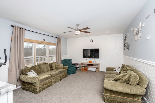 living room with recessed lighting, a ceiling fan, carpet flooring, and wainscoting