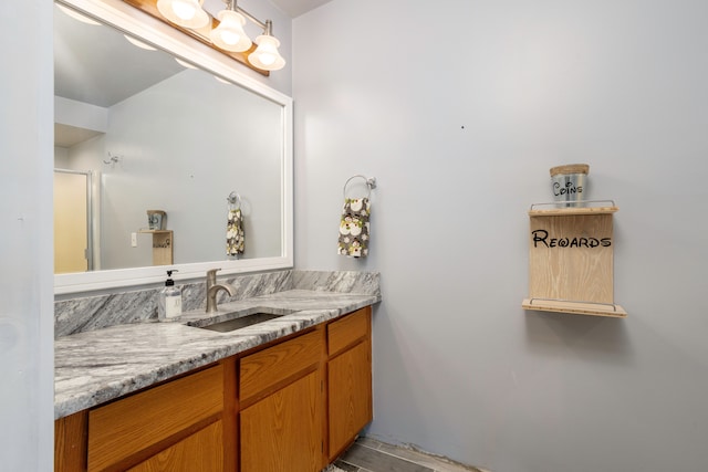 bathroom with vanity and an enclosed shower