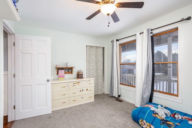 bedroom with ceiling fan, carpet, visible vents, and baseboards