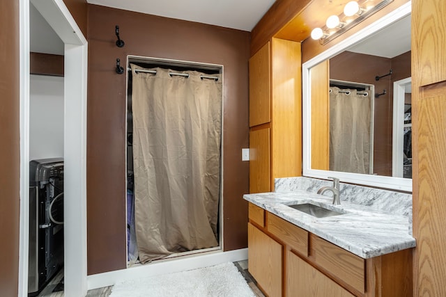 full bath featuring a shower stall and vanity