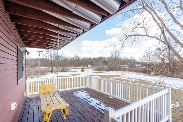 view of snow covered deck