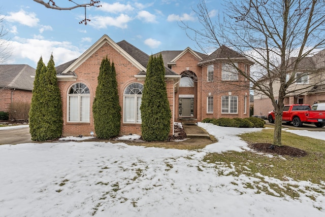 traditional-style home with brick siding