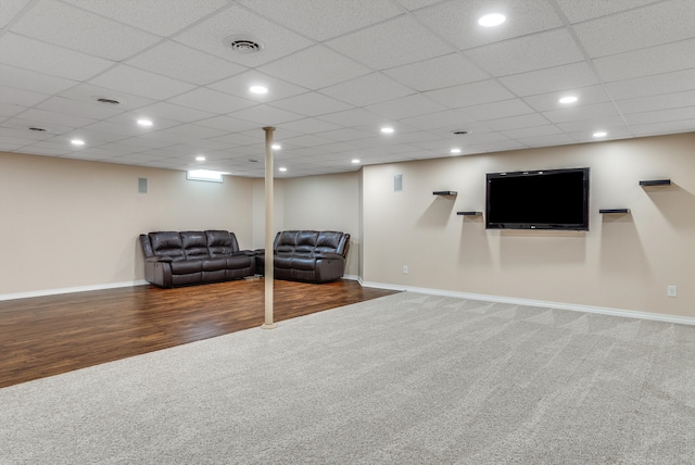 carpeted living area with recessed lighting, wood finished floors, visible vents, and baseboards