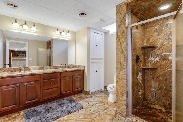 full bathroom with toilet, a marble finish shower, a sink, and visible vents