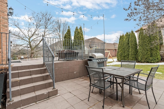 view of patio featuring outdoor dining area and grilling area