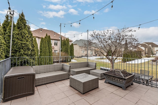 view of patio featuring a residential view and an outdoor living space with a fire pit