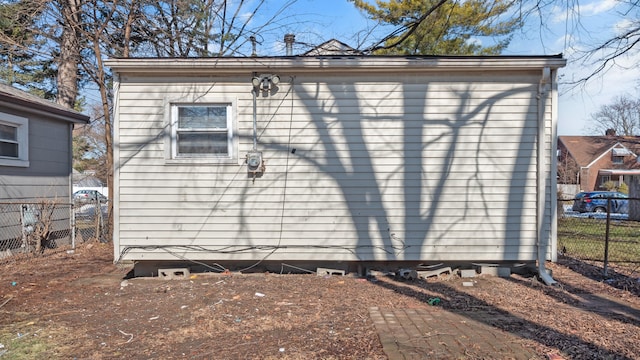 view of outbuilding with fence