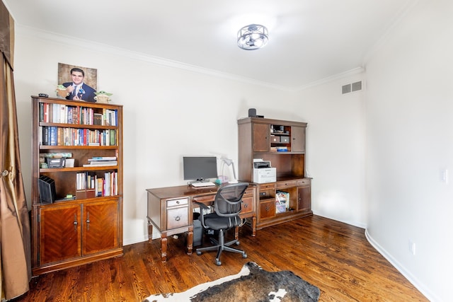 home office featuring ornamental molding, visible vents, baseboards, and wood finished floors