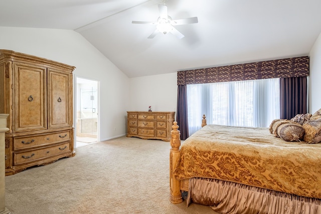 bedroom with lofted ceiling, light carpet, ceiling fan, and ensuite bath