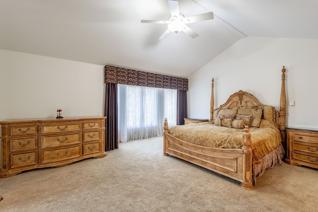 bedroom featuring light carpet, vaulted ceiling, and ceiling fan