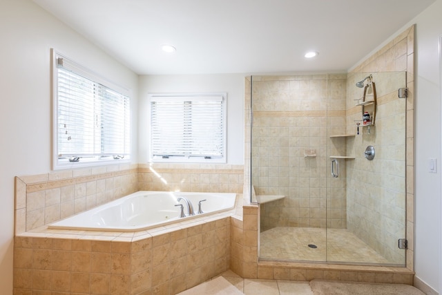 bathroom with a stall shower, tile patterned floors, recessed lighting, and a bath