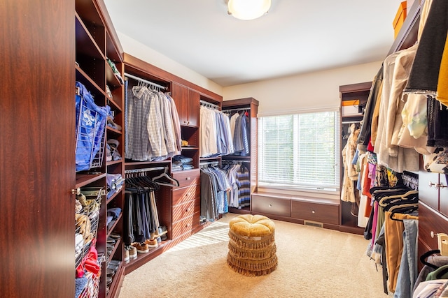 spacious closet with carpet floors and visible vents