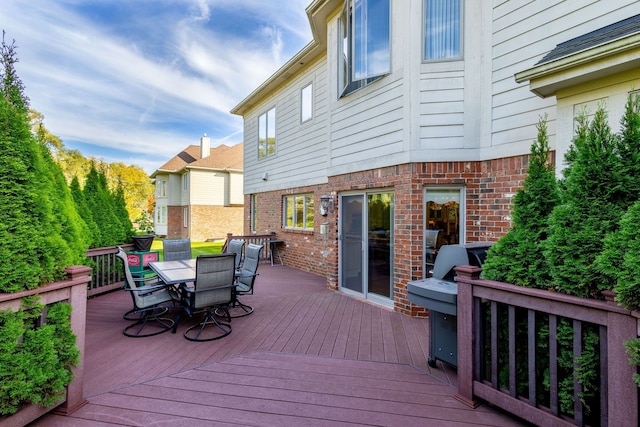 deck with outdoor dining space