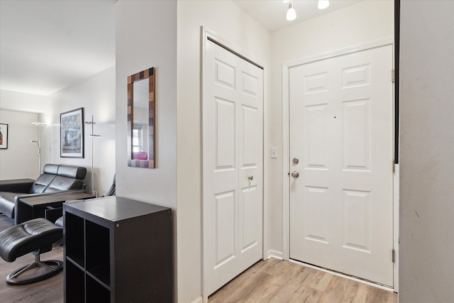 foyer with light wood-type flooring