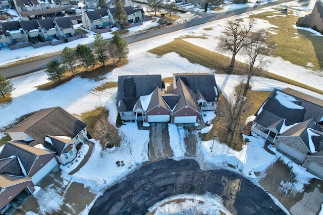 snowy aerial view featuring a residential view